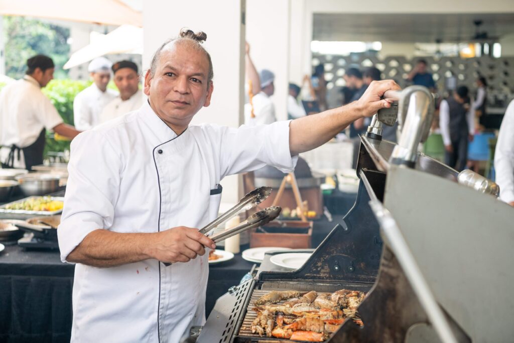 Chef Vivek Tamhane with the grill at BLVD Club